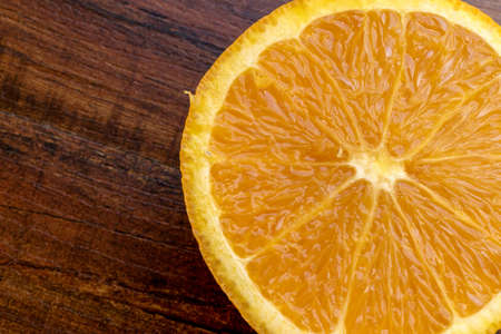 sweet Chilean orange, cut on a wooden board to be servedの写真素材