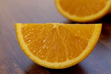 sweet Chilean orange, cut on a wooden board to be servedの写真素材