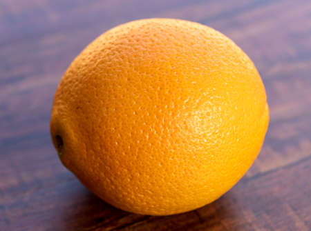 sweet Chilean orange, cut on a wooden board to be servedの写真素材