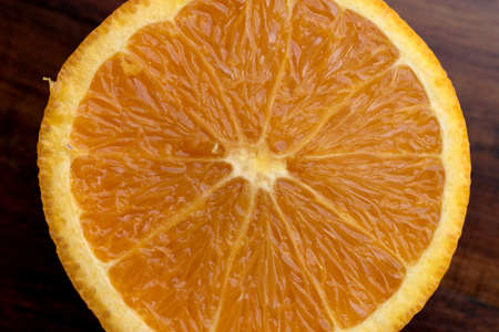 sweet Chilean orange, cut on a wooden board to be servedの写真素材