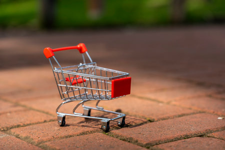 Shopping cart on the road in the park. Shallow depth of fieldの写真素材