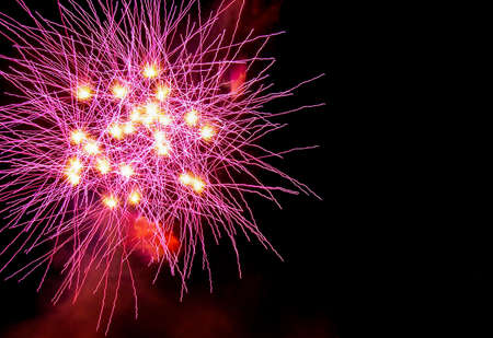 colorful fireworks red and yellow over night sky