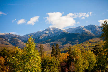 landscape with mountains and trees taken on an autumn day in the afternoonの写真素材