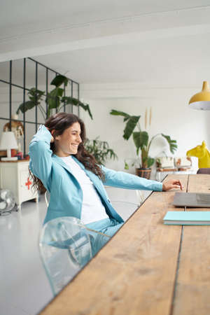 Woman finishes the job. Business woman working remotely online. At the end of the work celebrating...