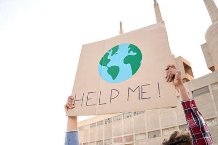 Help me poster claim during a street protestor for climate change.の写真素材