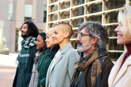 Diverse group faces of different ages and races with a corporate look. Outdoor portrait of business peopleの写真素材