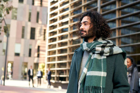 Copy space portrait of a young man outdoors in a corporate environment.の写真素材