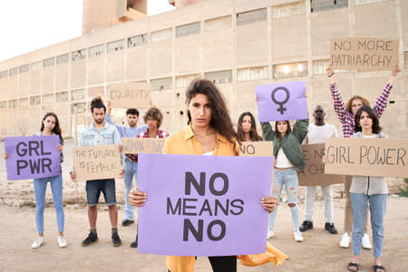 Group of people holding placard with word near feminist.の写真素材