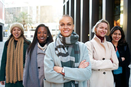 Cheerful portrait of a group of female business looking at the camera. Only woman workers. Group of women smiling with self-confidence. Feminist empowerment and gender equalityの写真素材