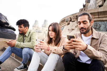 Individualist people chatting with smart phone ignoring each other using Mobile. Individualist...