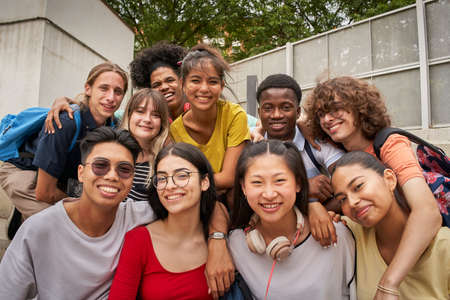 Selfie of a group of students looking at the camera smiling. Happy to be back to school.の写真素材