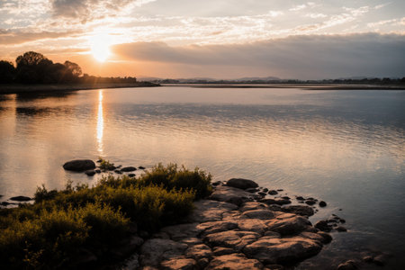 Beautiful sunset over the river. Summer landscape with a lake.の素材