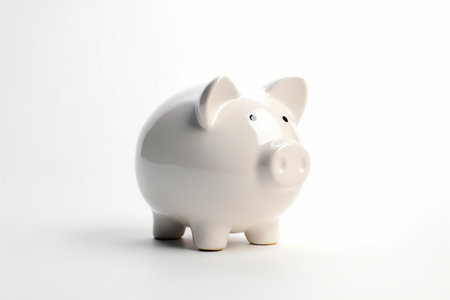 Ceramic white piggy bank with white background, concept of savings, foresight, bankingの素材