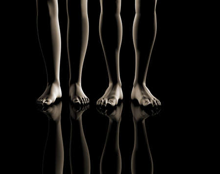 Frontal image of a feet of a woman and man in a black backgroundの写真素材