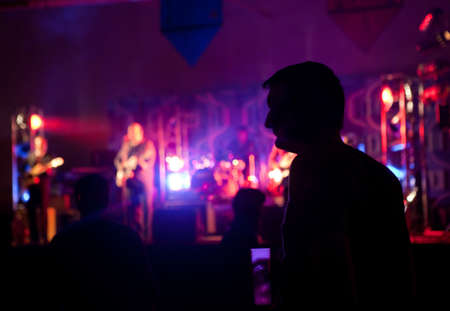 Silhouette of a man in public concertの写真素材