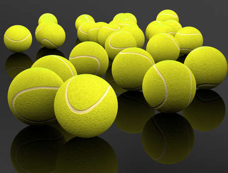 3d image of several tennis ball isolated in black backgroundの写真素材