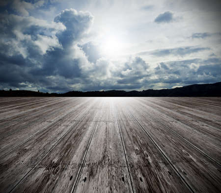 Background of old wood floor and cloudy skyの写真素材
