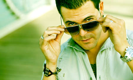 Young man with sunglasses on the streetの写真素材
