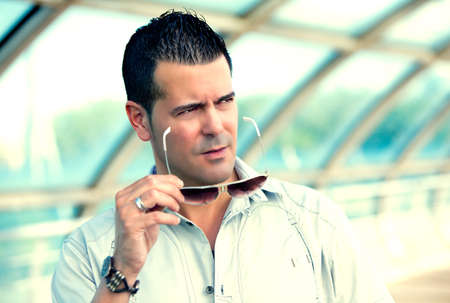 Young man with sunglasses on the streetの写真素材