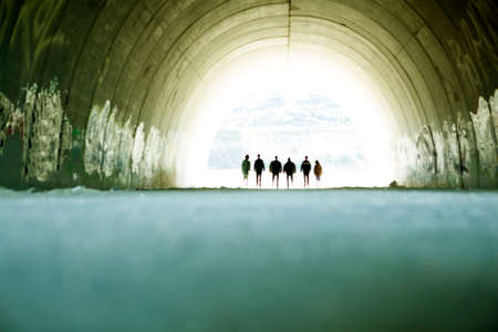 people silhouette walking on subway tunnelの写真素材