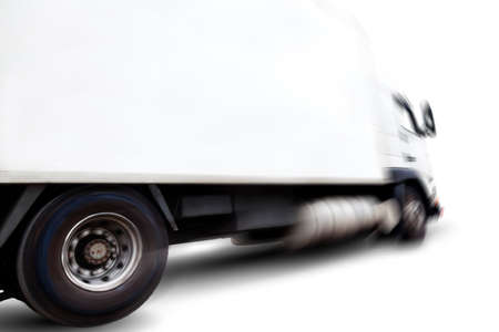 Truck isolated over white background .Motion blur.Transport of commodityの写真素材