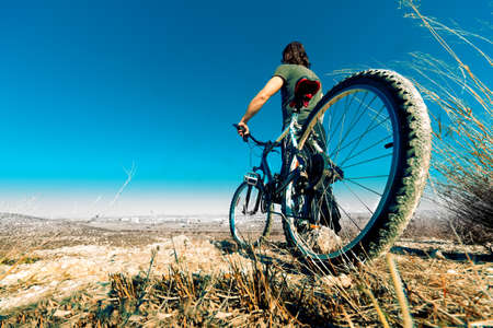 Landscape and young man with mountain bike.Lifestyle and sportの写真素材
