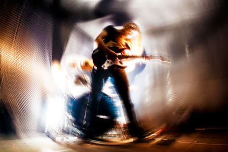 Man playing the guitar.Abstract Live music background concept.Guitar player and rock music concept
