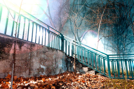 City night scene, fog and stairway.Old wall and fence