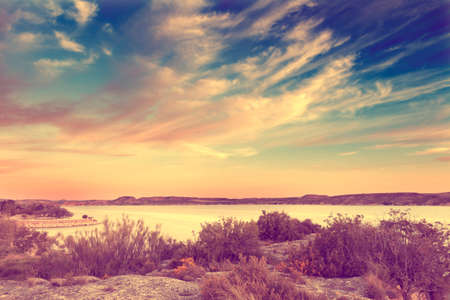 Nature scenery in retro style.Lake and vegetation in vintage effect. の写真素材