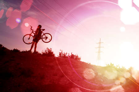 Sport and healthy life.Mountain bike and sunset.Extreme sportの写真素材