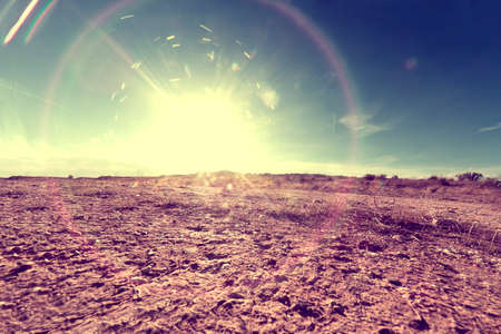 Outdoor soil floor background and sun in vintage style.の写真素材