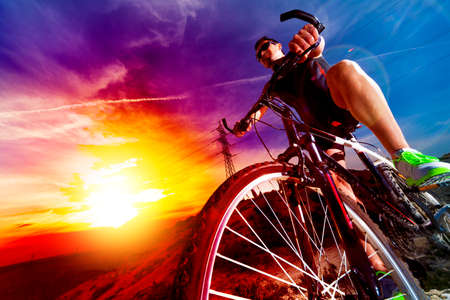 Sport and healthy life.Mountain bike and sunset.の写真素材