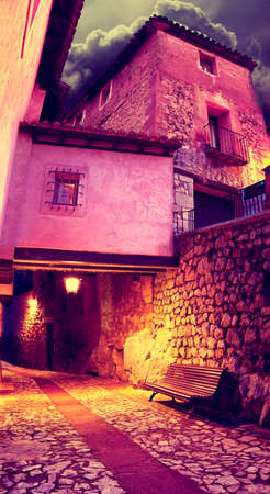Village street at night.Old cityscape and lamppostの写真素材