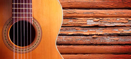 Spanish guitar and wood wall.Music backgroundの写真素材