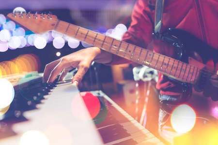 Guitar and piano keyboard detail.Live music and concert backgroundの写真素材