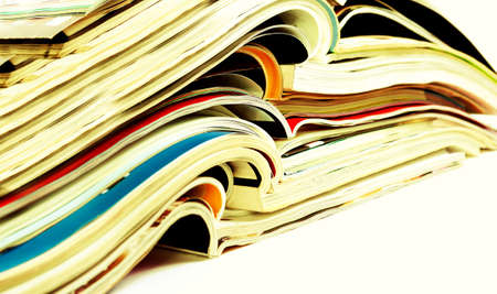 Close up image of magazines stack background. News and media publications