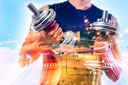 Gym equipment and sport concept.Double exposure background.Dumbbells.の写真素材