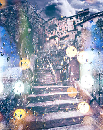 Abstract image of stone stairs and rain drops in the town.Flare lights and blurの写真素材