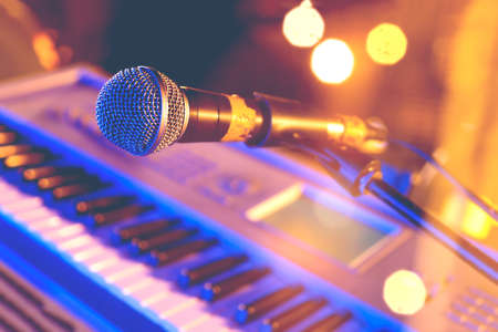 Microphone and piano  keyboard on stage.Concert and musical instrumentの写真素材