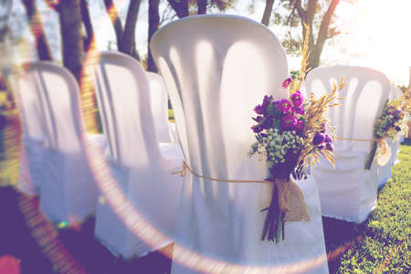 Bunch of flowers and chairs.Romantic and luxury celebration.Outdoor wedding decorationの写真素材