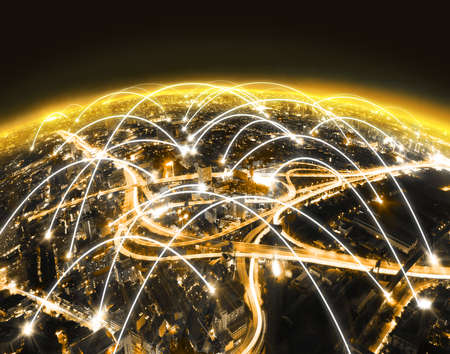 Futuristic design of network worldwide and global connection of internet of things.Cityscape at night and man looking away .Internet concept.の写真素材