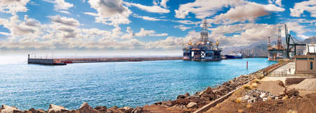 Commercial sea port and unloading cranes. International maritime logistics of merchandise.Port of the island of Tenerife. Canary Islands. Spainの写真素材