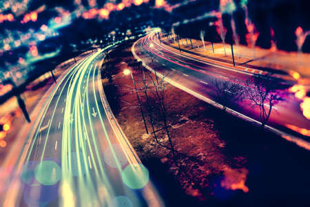 Abstract background of city and highway. Traffic and speed at night.