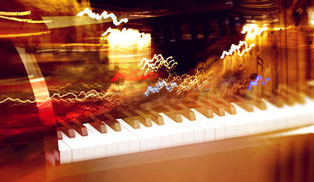 Grand piano detail and city lights.Melody and vibrant music conceptの写真素材