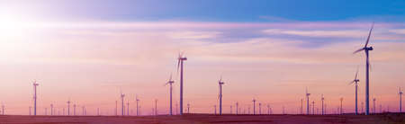 Eolic park and wind mills in sunset landscape and fields.Concept of engineering and renewable energies. Ecology and environmentの写真素材