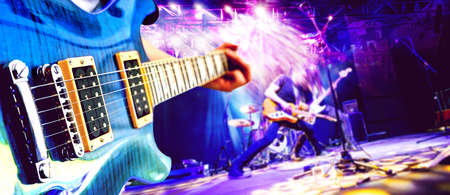 Musical performance on stage. Recreation and music show..Live music and concert background. Guitarist and drummer and singer.Night entertainment and festival events.の写真素材