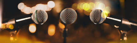 Musical design.Microphones.Live music and blurred stage lights. Music background.の写真素材
