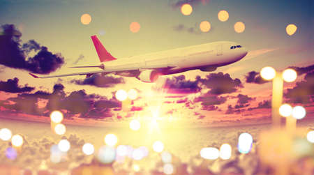 Concept of airplane travel. Flying above the city. Scenery sunset landscape.Sunrise and clouds. Flight and journey to destinationの写真素材