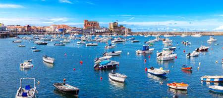 Scenery landscape of fishing port.Cityscape and boats in the sea.Cantabria village.Castrourdiales.の写真素材