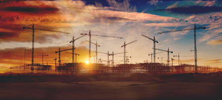 Construction and real estate industry. Sunset and foundation structure of houses.の写真素材